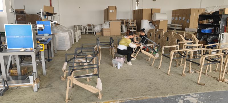 Skilled workers crafting durable outdoor furniture