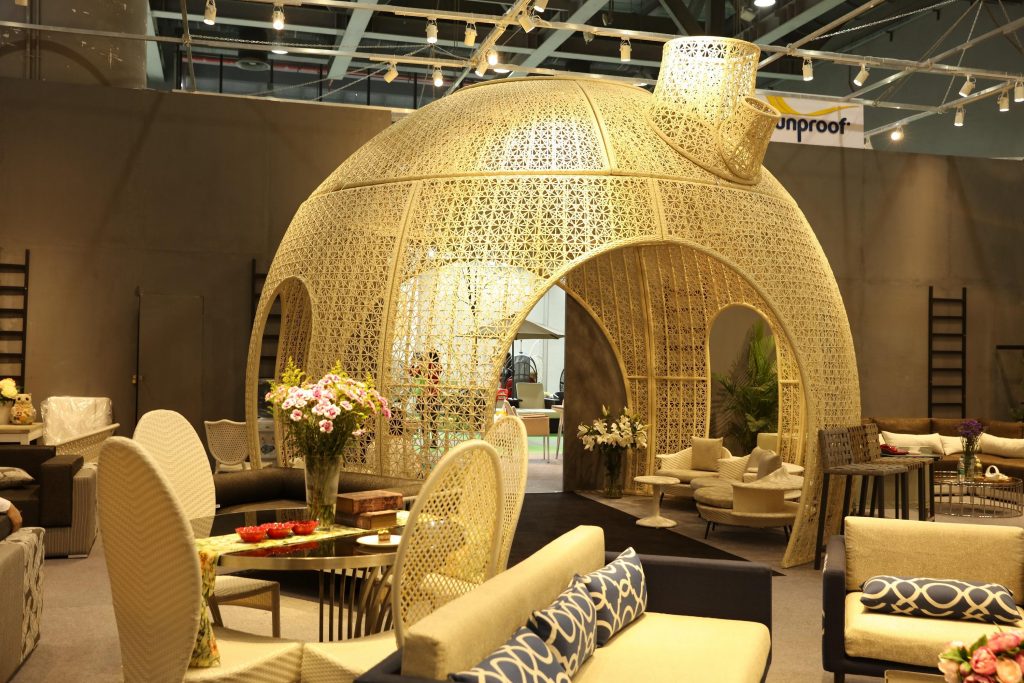 A close-up of a rattan outdoor sofa set at the furniture fair